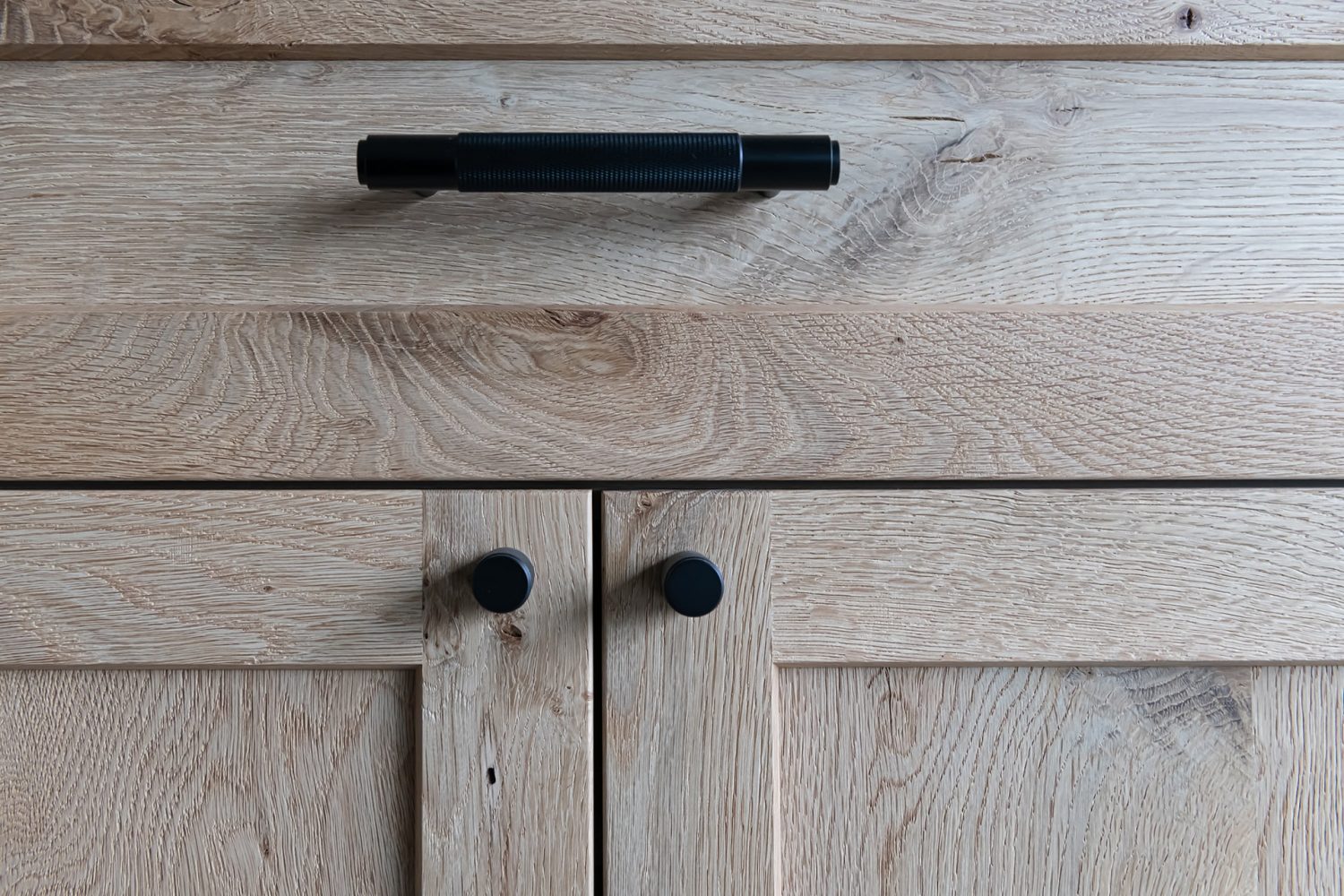 Gray weathered wood cabinet texture detail showing grain and craftsmanship